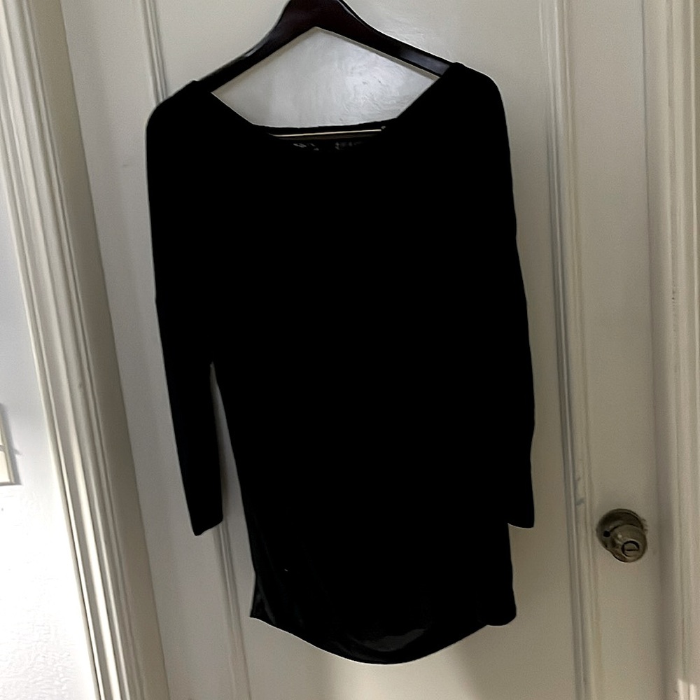 Black long sleeve tunic style. Sculpted front lace inset back. Size M